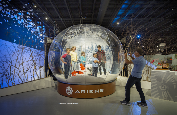 giant snow globe with family inside